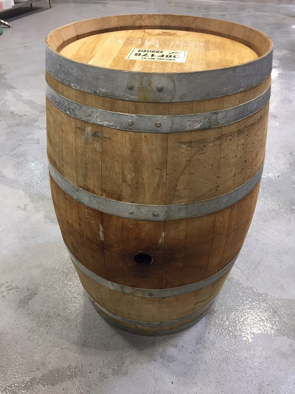 A photograph of a used wine barrel.