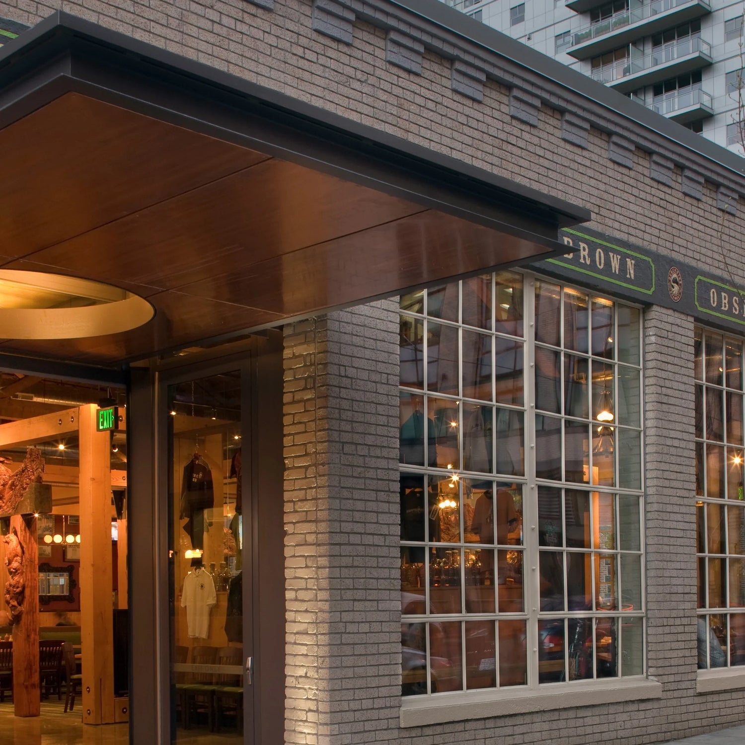 An exterior photograph of the Deschutes Brewing Portland Public House at dusk.