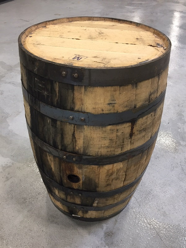 A photograph of a used bourbon barrel.
